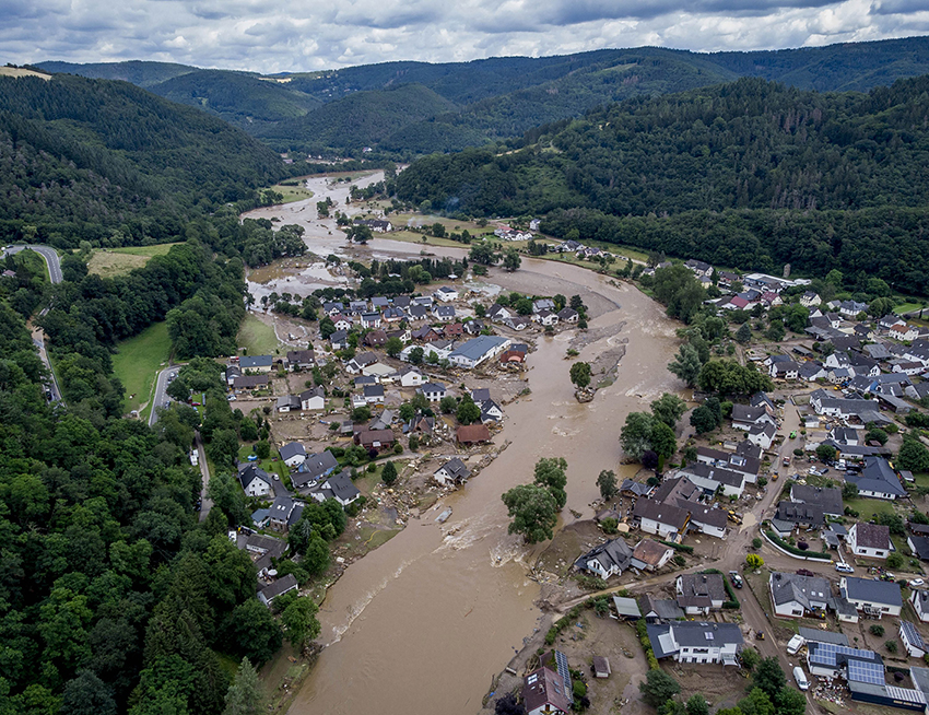 The Ahr river flows past houses destroyed by floods in Insul, Germany, July 15, 2021.